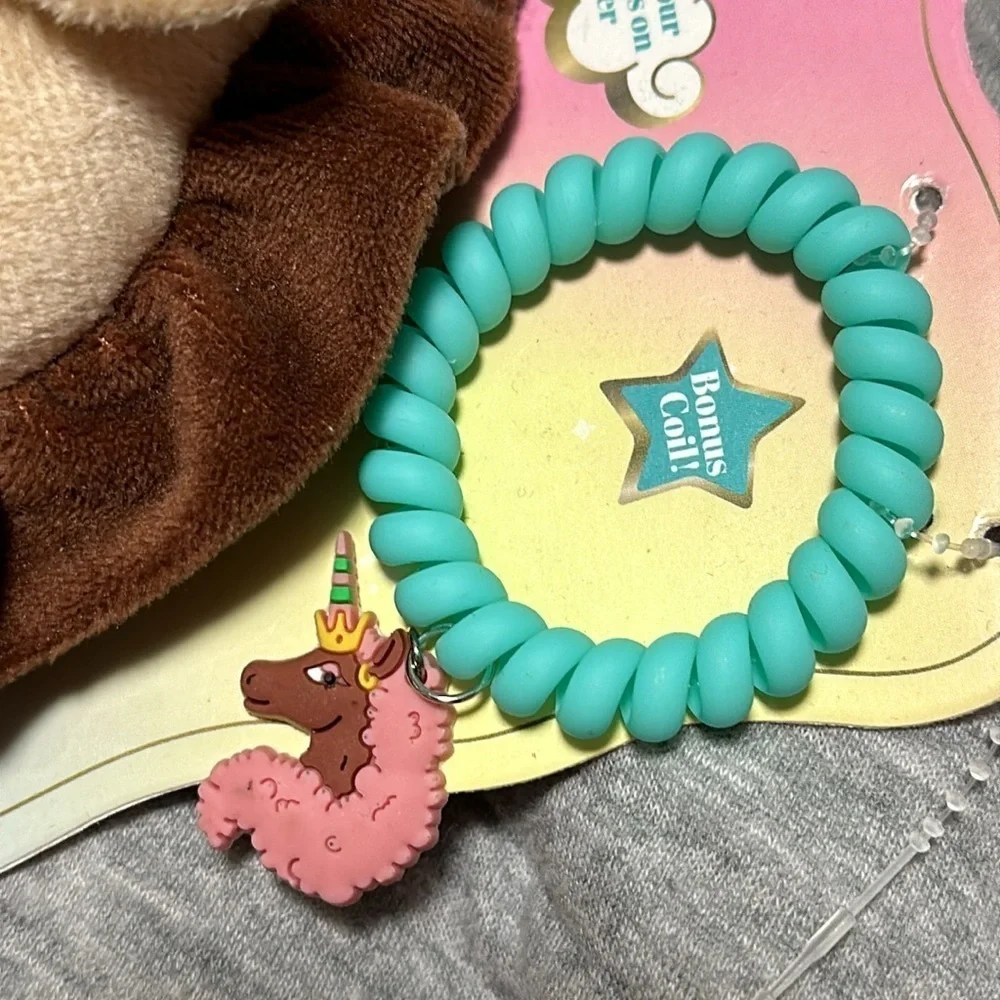 Afro unicorn toy and scrunchie set